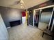 A bedroom with mirrored closet doors, ceiling fan, and tile flooring at 451 E Franklin Ave, Mesa, AZ 85204