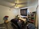 Bedroom featuring ceiling fan, wood-look vinyl floors, and closet at 451 E Franklin Ave, Mesa, AZ 85204