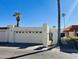 Charming single-story home features a two-car garage, courtyard entrance, and mature palm trees at 4765 W Mediterranean Dr, Glendale, AZ 85301