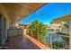 Private balcony overlooks the community pool and palm trees, offering a relaxing outdoor space at 520 W Clarendon Ave # E18, Phoenix, AZ 85013