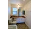 Cozy bathroom featuring a vanity with a wood countertop and a neutral color scheme at 520 W Clarendon Ave # E18, Phoenix, AZ 85013