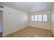 Bright bedroom with tile flooring and plantation shutters, creating a serene and inviting space at 520 W Clarendon Ave # E18, Phoenix, AZ 85013