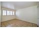 Bright bedroom with tiled floors and shuttered windows at 520 W Clarendon Ave # E18, Phoenix, AZ 85013