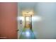 Hallway with a green speckled floor, white walls, bikes and a fire extinguisher at 520 W Clarendon Ave # E18, Phoenix, AZ 85013