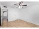 Bedroom with tile flooring, neutral walls, closet, and good lighting at 5226 W Freeway Ln, Glendale, AZ 85302