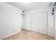 Bedroom with closet, tile flooring, and neutral walls at 5226 W Freeway Ln, Glendale, AZ 85302