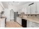 Well-lit kitchen features stainless steel appliances, neutral countertops, and tile flooring at 5226 W Freeway Ln, Glendale, AZ 85302