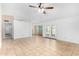 View of the living room, featuring tile floors, a ceiling fan and access to other areas at 5226 W Freeway Ln, Glendale, AZ 85302