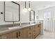 Bright bathroom featuring a double vanity, marble countertops, and modern fixtures at 5232 E Everett Dr, Scottsdale, AZ 85254