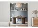 Dining room showcases a striking light fixture and floating shelves for displaying art and decor at 5232 E Everett Dr, Scottsdale, AZ 85254