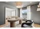 Dining room with grey walls, a view to the living room, and a stylish light fixture at 5232 E Everett Dr, Scottsdale, AZ 85254