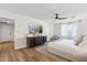 This bright and airy main bedroom boasts hardwood floors, ceiling fan, and serene natural light at 5232 E Everett Dr, Scottsdale, AZ 85254