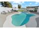 Gorgeous outdoor pool area featuring a spa, seating, pergola and artificial grass for effortless entertaining at 5232 E Everett Dr, Scottsdale, AZ 85254