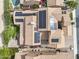 Aerial view of home with solar panels, well-manicured landscaping, and a private pool in a desert community at 5636 E Libby St, Scottsdale, AZ 85254