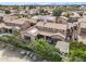 Aerial view of a charming suburban community featuring tile roofs, solar panels and well-kept landscaping at 5636 E Libby St, Scottsdale, AZ 85254