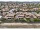 Expansive aerial view showcasing the rooftops of a densely populated community at 5636 E Libby St, Scottsdale, AZ 85254