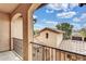 Charming balcony view with wrought iron railings overlooking beautiful Arizona neighborhood with Spanish tile roofs at 5636 E Libby St, Scottsdale, AZ 85254