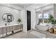 Modern bathroom featuring a soaking tub, vanity, and elegant fixtures at 5636 E Libby St, Scottsdale, AZ 85254