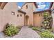 Charming courtyard with a brick pathway and lush, green landscaping at 5636 E Libby St, Scottsdale, AZ 85254