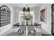 Bright dining room featuring a large window, modern light fixtures, and table with seating at 5636 E Libby St, Scottsdale, AZ 85254