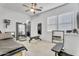 Bright exercise room with mirrored walls, ceiling fan and fitness equipment at 5636 E Libby St, Scottsdale, AZ 85254