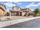 Charming home featuring a three-car garage and a well-maintained front yard at 5636 E Libby St, Scottsdale, AZ 85254