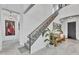 Elegant foyer with staircase, showcasing high ceilings and tile flooring at 5636 E Libby St, Scottsdale, AZ 85254