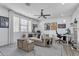 Comfortable living room features contemporary decor, natural lighting, and an adjacent workspace at 5636 E Libby St, Scottsdale, AZ 85254