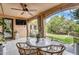 Elegant covered patio with a dining area and a view of the landscaped backyard, perfect for entertaining at 5636 E Libby St, Scottsdale, AZ 85254