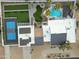 Overhead shot showcasing a private home with pool, putting green, and sports court at 6601 E Hearn Rd, Scottsdale, AZ 85254