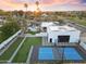 Aerial view of a home showcasing a pool, putting green, and sports court, creating the ultimate entertainment space at 6601 E Hearn Rd, Scottsdale, AZ 85254