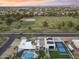 Aerial view of the modern home and neighborhood amenities including a large community park at 6601 E Hearn Rd, Scottsdale, AZ 85254