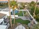 Expansive backyard featuring a pool, putting green, and a sports court at 6601 E Hearn Rd, Scottsdale, AZ 85254