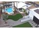 Aerial view of the pool, patio, putting green, and backyard at 6601 E Hearn Rd, Scottsdale, AZ 85254