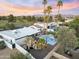 Backyard aerial showcasing a pool, cabana, and tropical landscaping, perfect for outdoor living and entertaining at 6601 E Hearn Rd, Scottsdale, AZ 85254