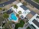 Aerial view of the backyard featuring a pool, turf, patio area, and desert landscaping surrounding the property at 6601 E Hearn Rd, Scottsdale, AZ 85254