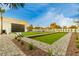 Backyard bocce ball court with chairs and putting green at 6601 E Hearn Rd, Scottsdale, AZ 85254