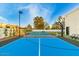 Basketball court, with a basketball hoop and court lighting at 6601 E Hearn Rd, Scottsdale, AZ 85254