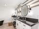 Bathroom featuring double sinks, sleek countertops, and modern fixtures at 6601 E Hearn Rd, Scottsdale, AZ 85254