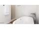 A standalone tub with modern fixtures and a shower in background at 6601 E Hearn Rd, Scottsdale, AZ 85254