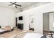 Light-filled bedroom features hardwood floors, ensuite bathroom and modern decor at 6601 E Hearn Rd, Scottsdale, AZ 85254