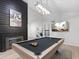 Well-lit game room showcasing a pool table, modern lighting, and a contemporary design at 6601 E Hearn Rd, Scottsdale, AZ 85254