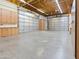 Large garage with multiple doors and ample cabinet storage at 6601 E Hearn Rd, Scottsdale, AZ 85254