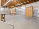 A sizable garage equipped with storage cabinets and multiple doors at 6601 E Hearn Rd, Scottsdale, AZ 85254