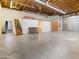 Spacious garage with a loft and ample storage space and doors at 6601 E Hearn Rd, Scottsdale, AZ 85254