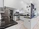 Well-designed kitchen with an island, stainless steel appliances, and sleek black countertops at 6601 E Hearn Rd, Scottsdale, AZ 85254