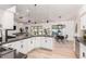 Bright kitchen with black countertops and stainless steel appliances with backyard view at 6601 E Hearn Rd, Scottsdale, AZ 85254