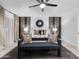 Serene main bedroom with a decorative accent wall, modern lighting, and comfortable furnishings at 6601 E Hearn Rd, Scottsdale, AZ 85254