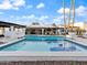 Beautiful backyard pool with an outdoor kitchen and covered seating area for entertaining at 6601 E Hearn Rd, Scottsdale, AZ 85254