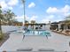 A sparkling swimming pool with a sun shelf and travertine decking at 6601 E Hearn Rd, Scottsdale, AZ 85254